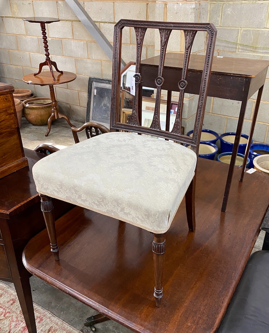 A George III carved mahogany dining chair